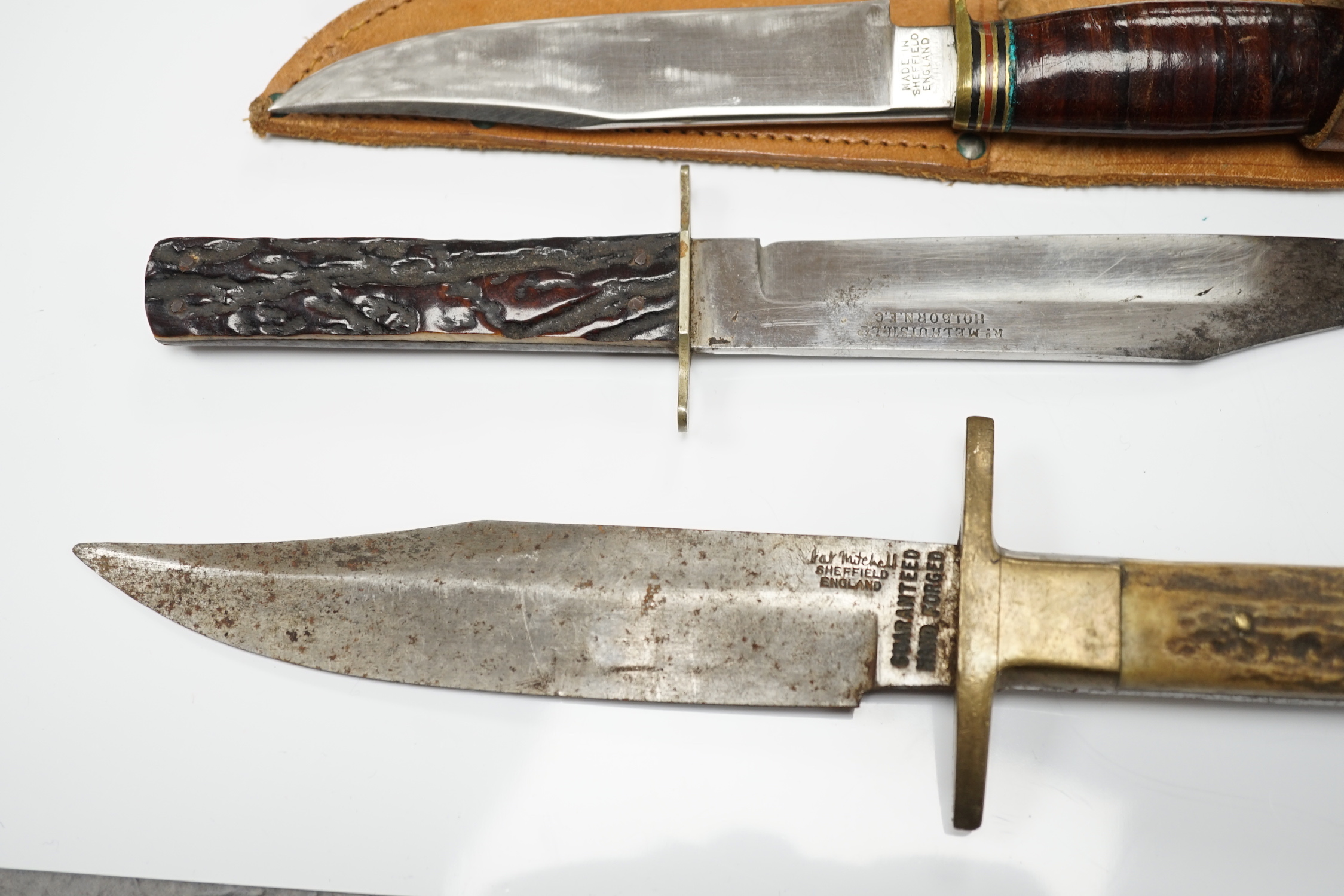 Two antler-handled hunting knives and three other knives